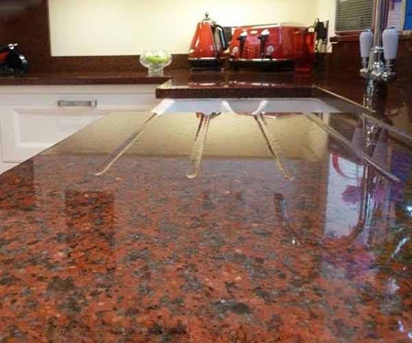 Aswan Red — polished Egyptian granite as a kitchen worktop